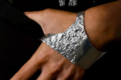 Person wearing sterling silver palm cuff bracelet